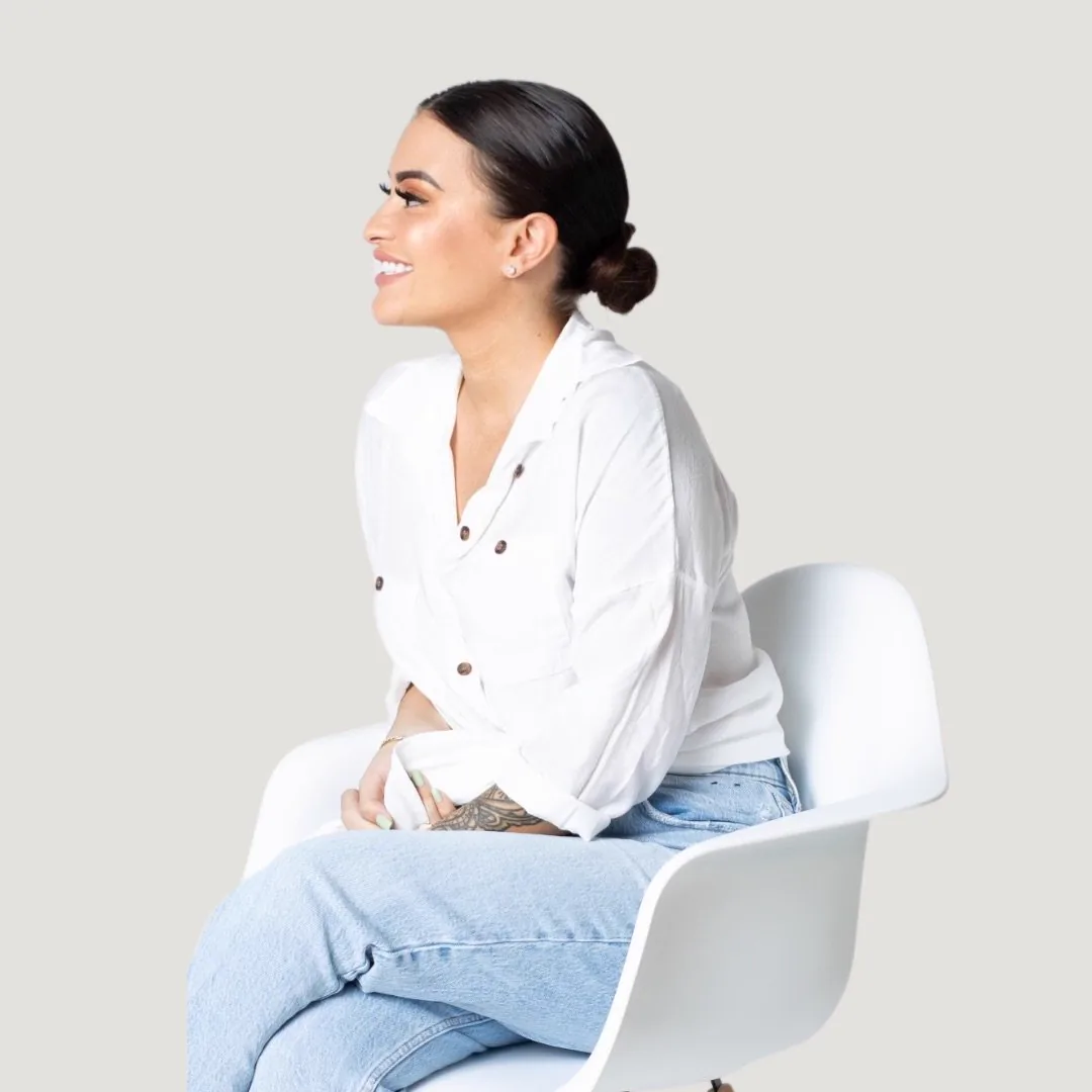 Erica Battista smiling during a Maternal Mind & Wellness portrait session